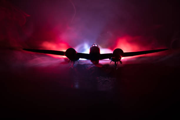 German Junker (Ju-88) night bomber at night. Artwork decoration with scale model of jet-propelled plane in possession.