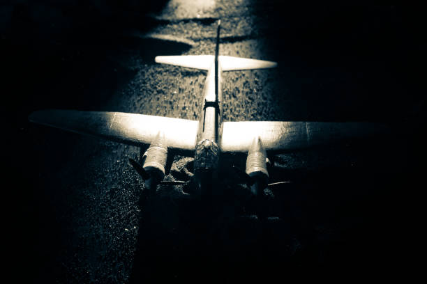 istock German Junker (Ju-88) night bomber at night. Artwork decoration with scale model of jet-propelled plane in possession. 1226762727