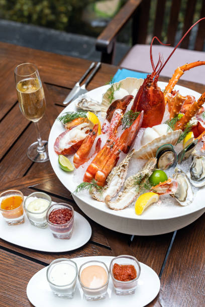 istock Seafood on ice with white wine 1226762769