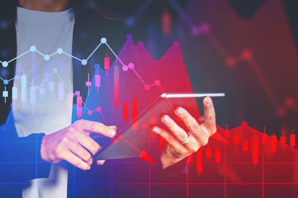 istock Hands of woman with tablet, falling graph 1226763352
