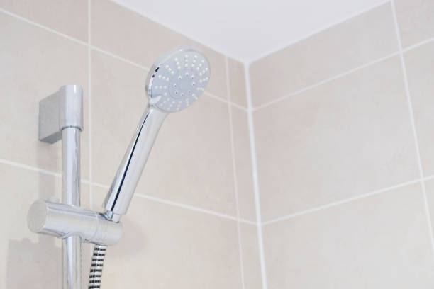 istock Chrome modern shower head and neutral tiles in bathroom ensuite 1226764227