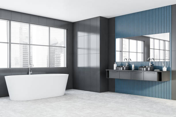 istock Gray and blue bathroom corner with tub and sink 1226764634