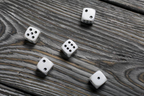 istock Dices are white with black dots. On brushed pine boards. 1226764769