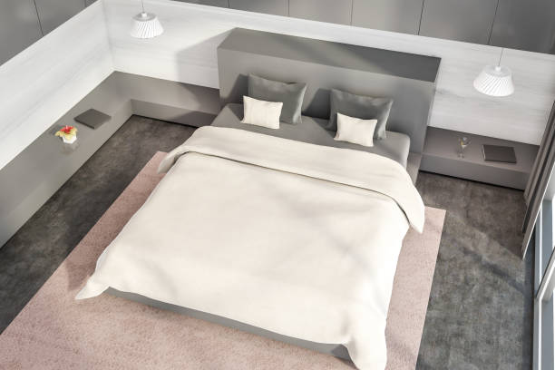 istock Gray and white bedroom with beige blanket top view 1226764944