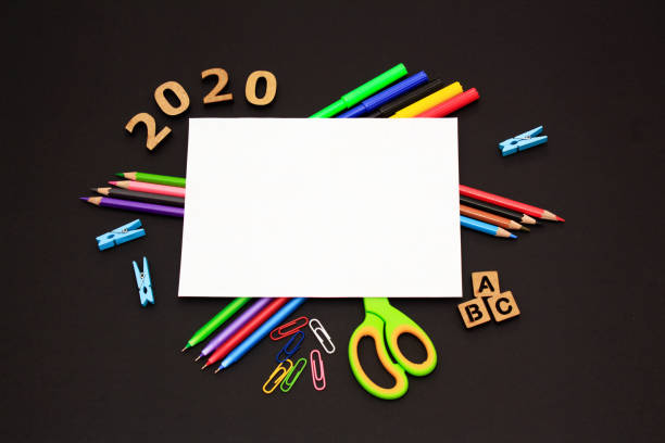 istock School accessories on black paper background 1226766795