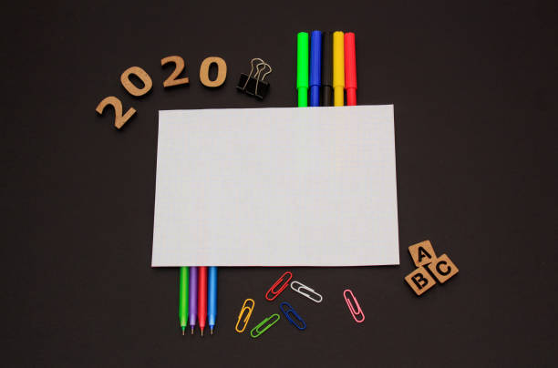 istock School accessories on black paper background 1226767379