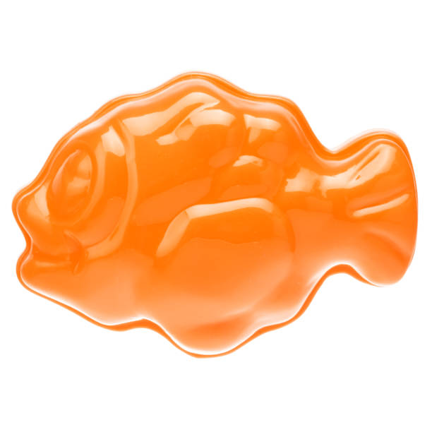 istock Orange plastic fish on a white background, close-up. Children's toys for bathing babies. Educational games for children, preschool education. Layout, preparation of toys for the designer or website 1226767621