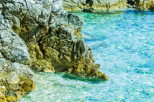 Crystal clear sea water at summer travel destination croatian mediterranean beach.