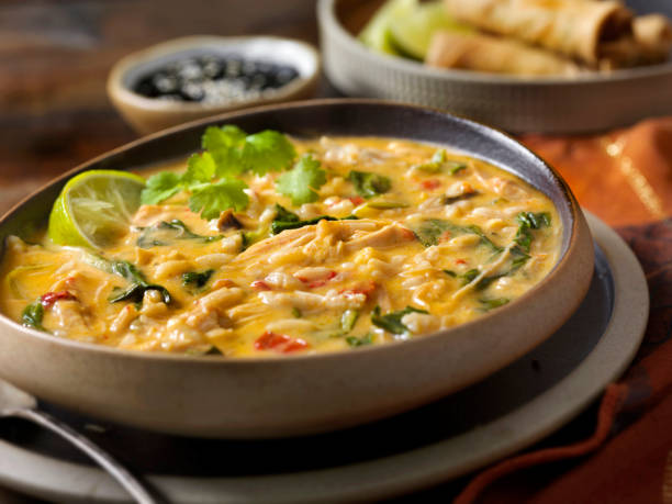 istock Creamy Thai, Chicken and Rice Soup with Spring Rolls 1226768077