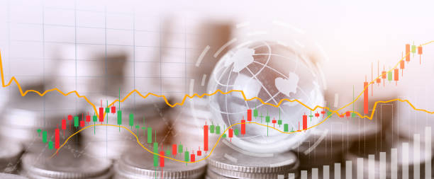 Coins stack and financial stock market graph.