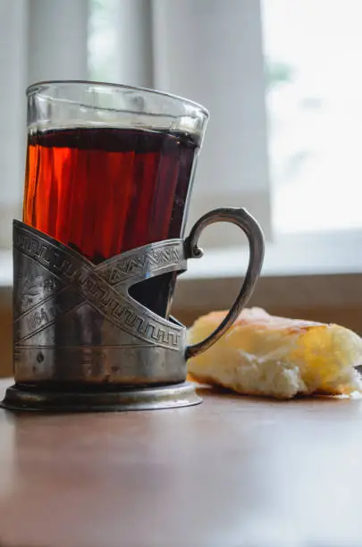 Photo of A mug with a handful of bread on the table in the hospital