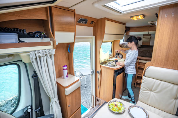istock Woman cooking in camper, motorhome interior 1226770933