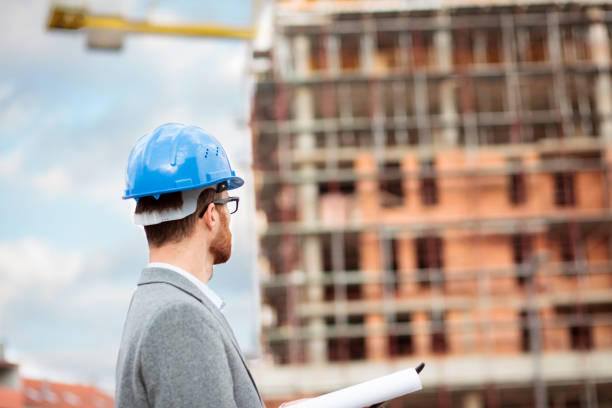 istock Focused young architect or businessman inspecting large construction site 1226772052
