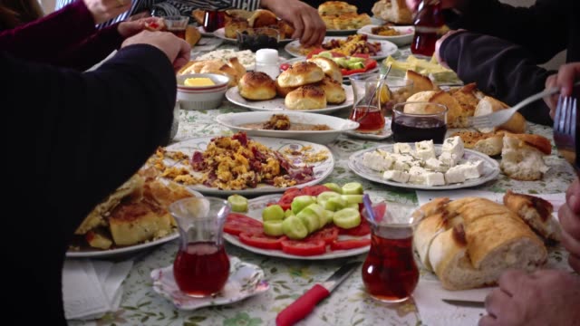Muslim family having breakfast together celebrating eid-ul-fitr after Ramadan