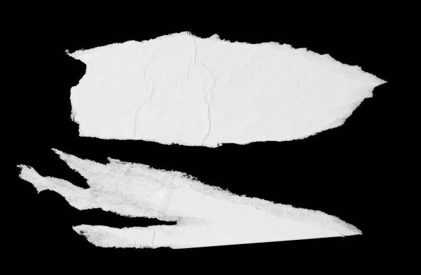 Torn glued white paper pieces isolated on black background Torn glued paper texture. White ripped wrinkled paper poster pieces isolated on black background wild posting ad stock pictures, royalty-free photos & images