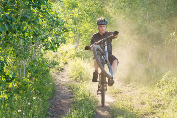 istock Doing Wheelie Crosscountry Mountain Biking Young Man 1226773432