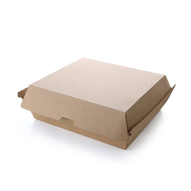 Blank closed brown craft pizza box isolated on white background. Empty eco friendly disposable package. Clear delivery kraft box for fast food, branding, mock up & template.