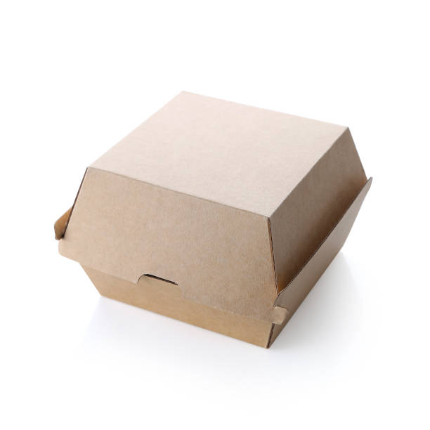 istock Blank closed brown craft burger box isolated on white background. Empty eco friendly disposable package for burger & sandwich. 1226773725