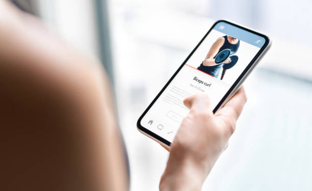 istock Gym training app in phone. Online personal trainer or video tutorial mockup in smartphone. Home workout with fitness class or digital sport coach. Exercise instruction. Getting fit. 1226773869
