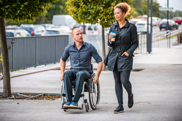 istock Young Business Colleagues Talking on Way to Work 1226774890