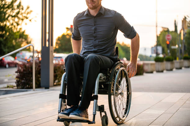 istock Businessman with Physical Disability Rolling into Sunshine 1226774988