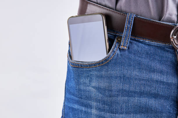 istock male person with a phone  at front jeans pocket. empty display mockup. 1226777443
