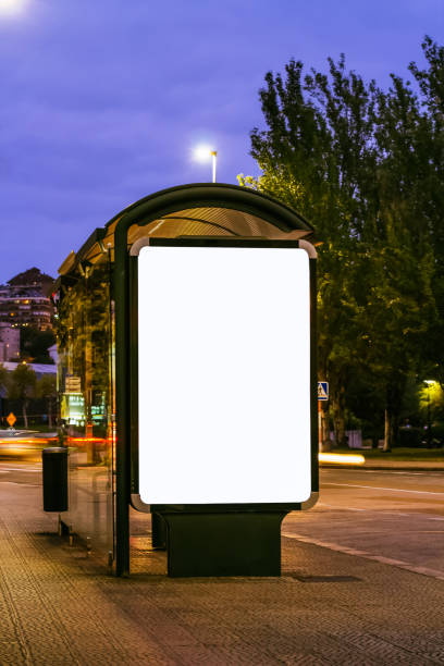 istock Blank mock up of vertical light box in bus stop at night 1226779374