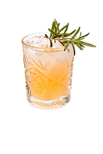 Cocktail with orange juice and ice cube in highball glass isolated on white background.