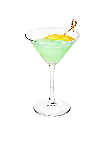 Martini with green olives splash. Copy space.