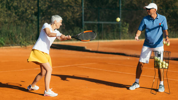 istock Active Senior Woman Practicing Tennis 1226782090