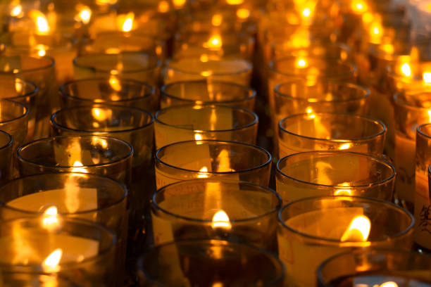 istock Many candle light in glass burning in the dark 1226782205