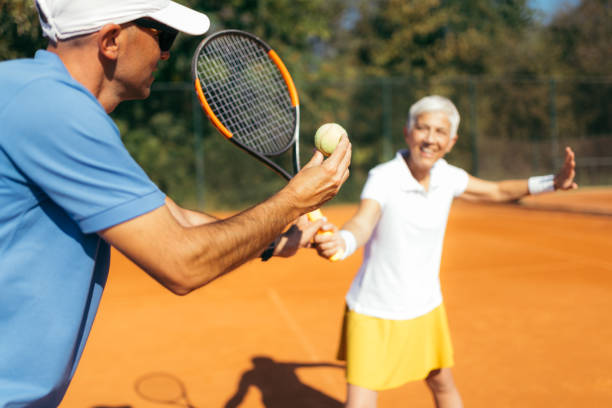 istock Mature Woman Playing Tennis 1226783640