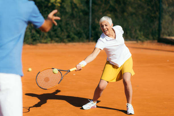 istock Beautiful Mature Active Woman Playing Tennis 1226784544