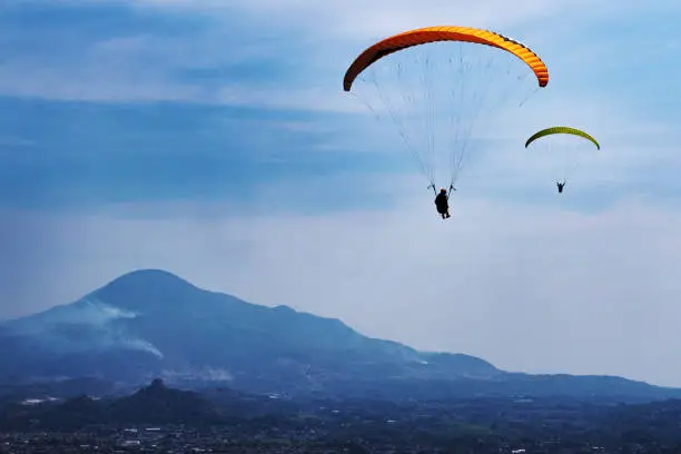 Photo of Paragliding and landscape.