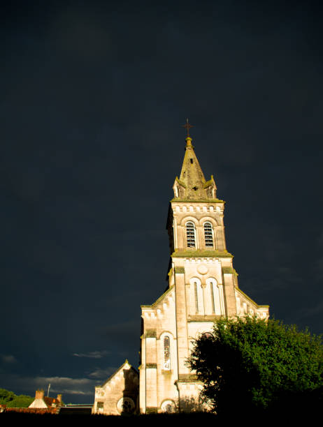 istock Bright sunlight on a French church front 1226787671