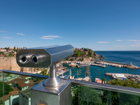 Binoculars with San Sebastian Castle in Cadiz in the background.