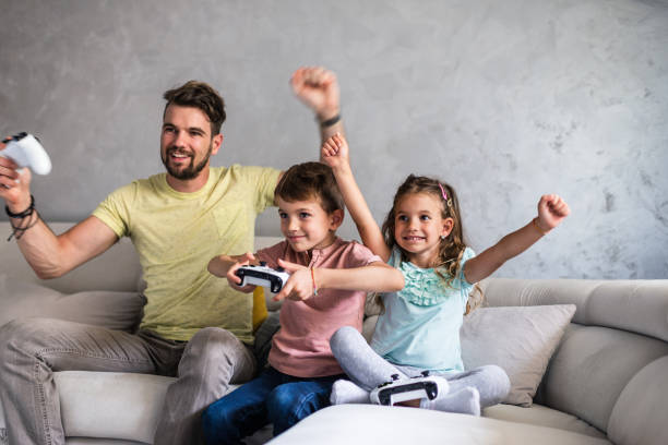 istock Playing video games with our dad 1226788067
