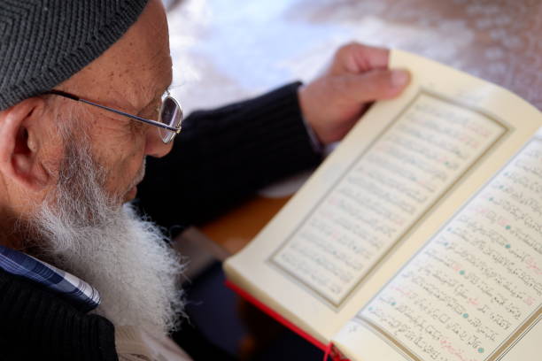 istock Elderly Muslim Turkish Man reading Holy Quran during Ramadan 1226788834