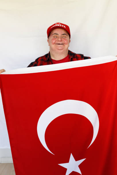 istock Woman with down syndrome holding Turkish flag 1226788981