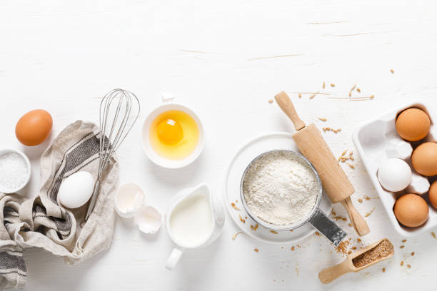 istock Baking homemade bread on white kitchen worktop with ingredients for cooking, culinary background, copy space, overhead view 1226789473