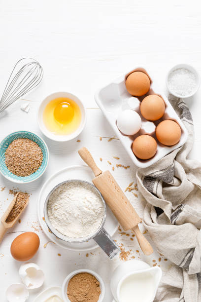 istock Baking homemade bread on white kitchen worktop with ingredients for cooking, culinary background, copy space, overhead view 1226789474