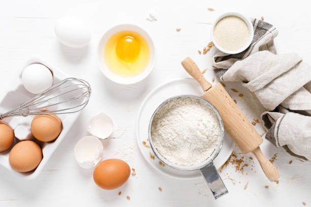 istock Baking homemade bread on white kitchen worktop with ingredients for cooking, culinary background, copy space, overhead view 1226790363