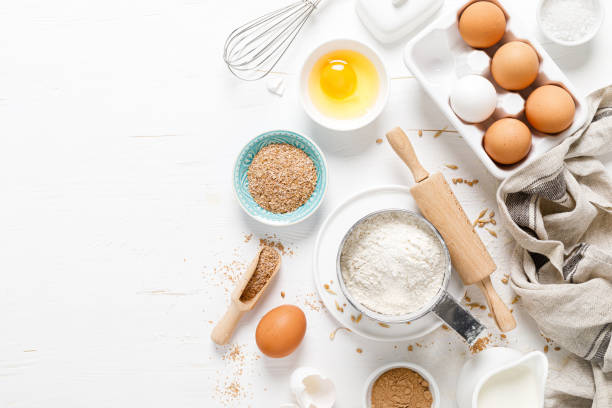 istock Baking homemade bread on white kitchen worktop with ingredients for cooking, culinary background, copy space, overhead view 1226790596
