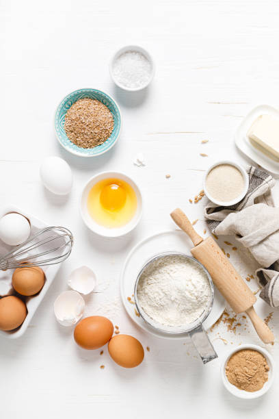 istock Baking homemade bread on white kitchen worktop with ingredients for cooking, culinary background, copy space, overhead view 1226790882