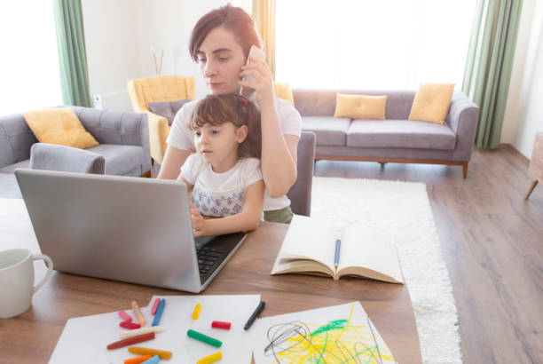 istock Young mother working and spending time with her daughter 1226793290