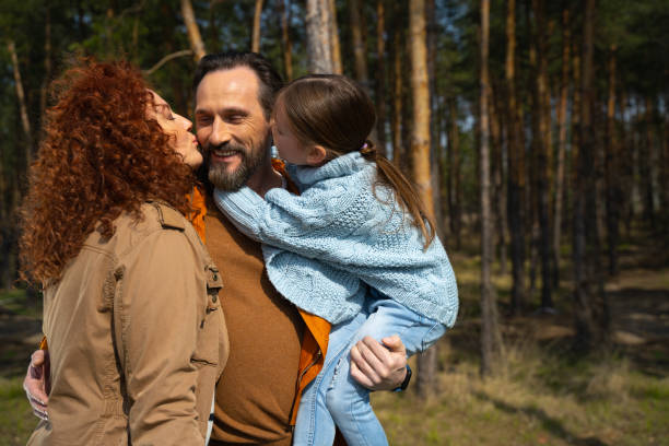 istock Happy loving family spending time together in forest 1226793494