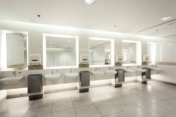 istock Restroom interior with big mirrors and white sinks 1226793698