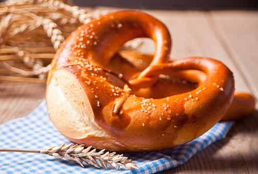 Freshly baked homemade salt Bavarian pretzel. German bakery. Close up.