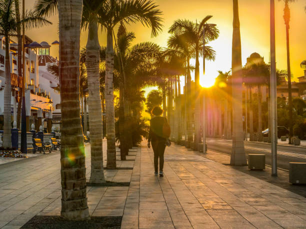 istock A woman walks on an empty street due Covid-19 during sunset 1226796639