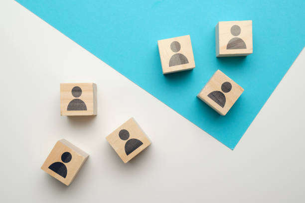 istock Team competition concept at work with icons on wooden blocks. 1226797805
